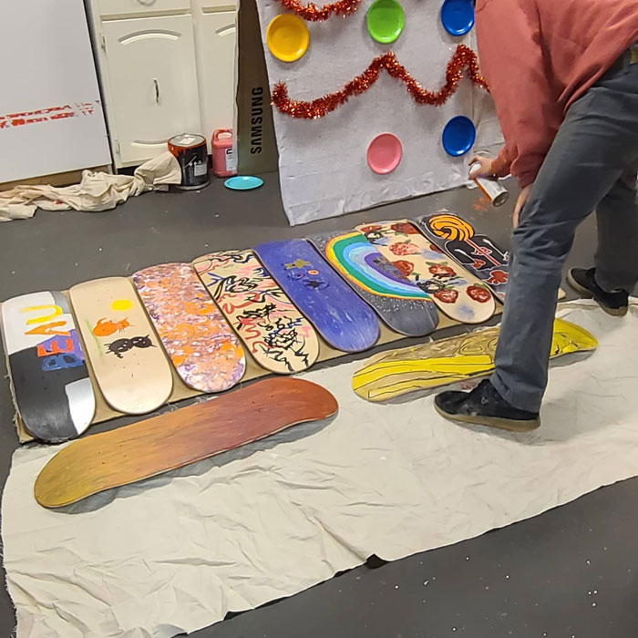 Skateboard deck painting workshop at OUTLoud.